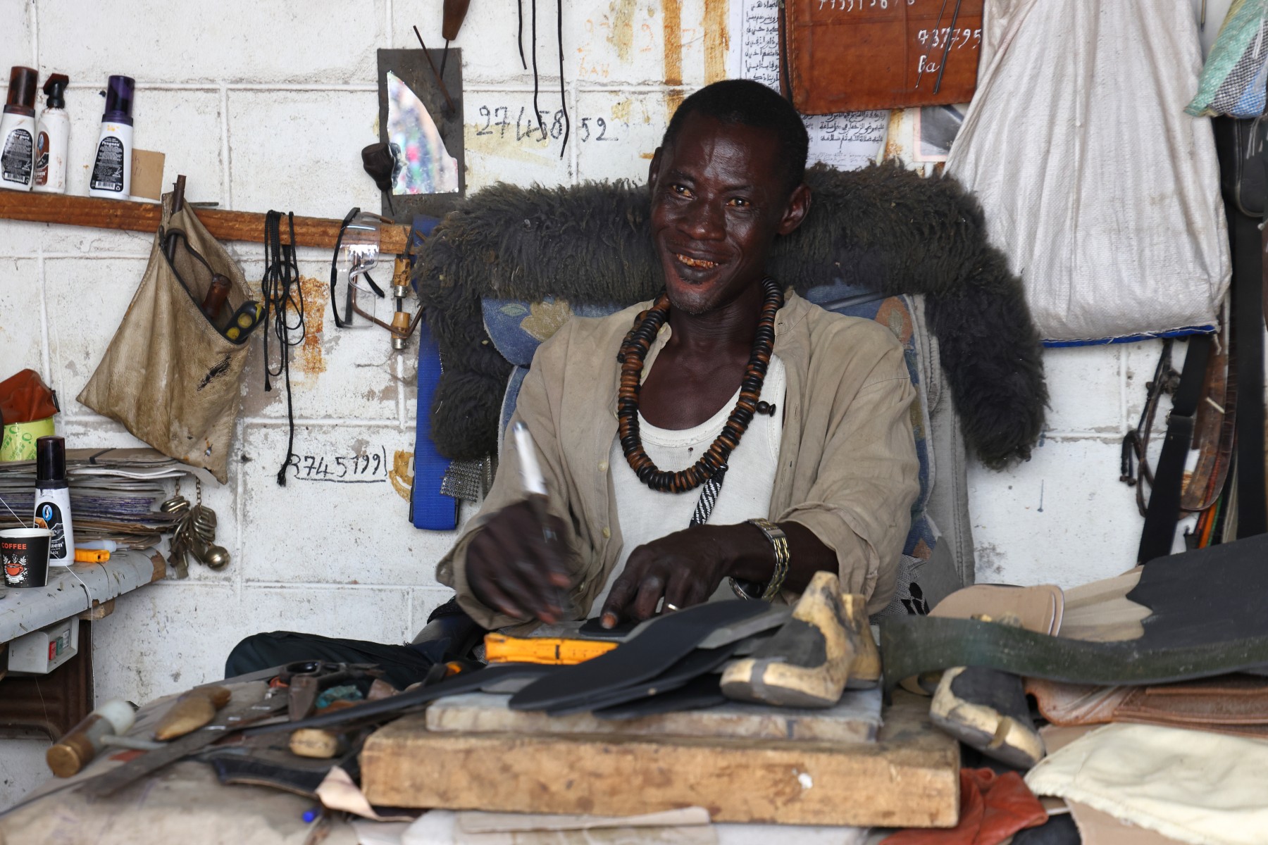 Banjul - Albert market - Leather worker